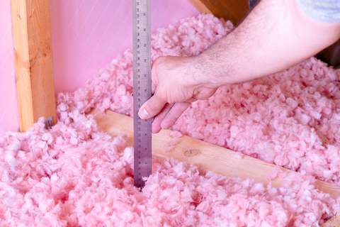 We measure the height of the insulation added