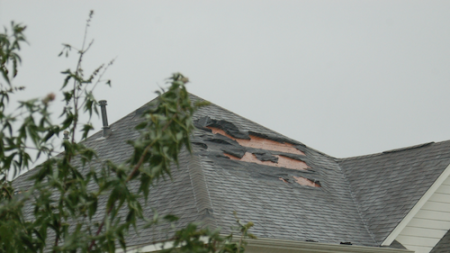 Asphalt Shingle Blown Off Home By Strong Winds